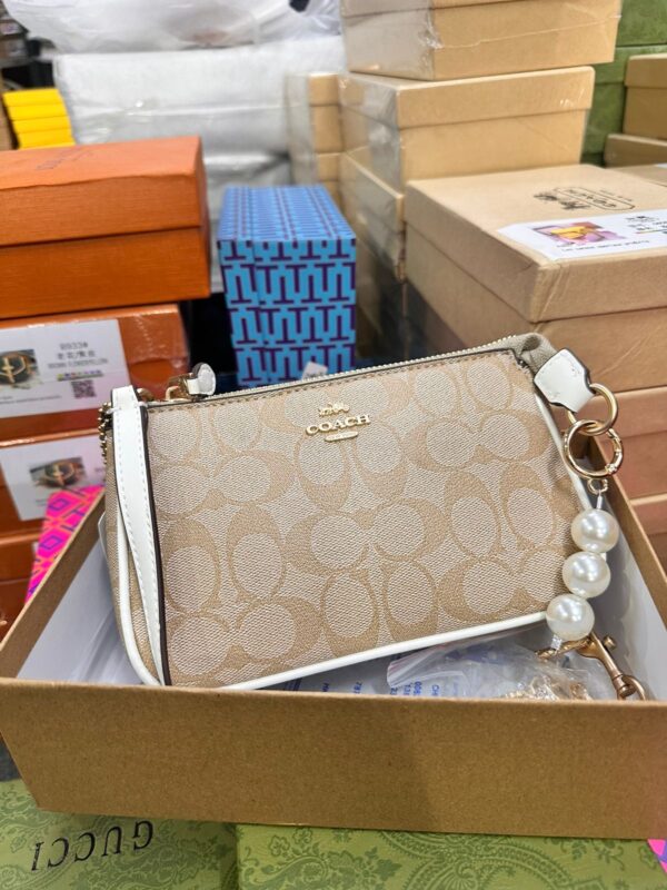 COACHH LATEST EDITION SLING