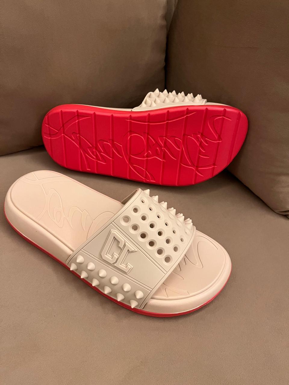 ChristianE louboutin slides in stock